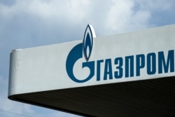 FILE - The logo of Russia's energy giant Gazprom is pictured at one of its gasoline stations in Moscow, April 16, 2021.
