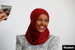 Fashion model and former refugee Halima Aden has her makeup applied during a shoot at a studio in New York City, Aug. 28, 2017.