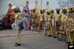 Policemen stand guard near the state secretariat anticipating protests following reports of two women entering the Sabarimala temple in Thiruvananthapuram, Kerala, India, Jan. 2, 2019
