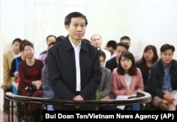 FILE - Vietnam's prominent blogger Nguyen Huu Vinh, shown on trial in Hanoi, Vietnam, was sentenced to five years in prison for posting anti-state writings.