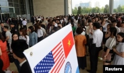 People wait to enter the National Convention Center, where President Barack Obama delivered his speech, in Hanoi, May 24, 2016.
