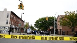 In this file photo taken on October 12, 2019 Police tape secures a crime scene outside a club after a shooting in Brooklyn.