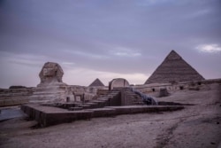 This March 30, 2020 photo, shows the empty Giza Pyramids and Sphinx complex on lockdown due to the coronavirus outbreak in Egypt.