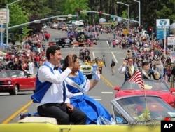 This 2015 photo provided by Glenn Harrington shows the Gold Nugget Days parade moving along the street in Paradise, Calif.