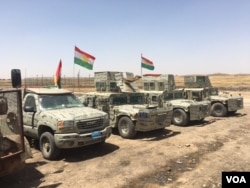 FILE - Iraqi Kurdish Peshmerga vehicles line up outside their new base in a house that they retook from IS in an offensive that pushed the frontline 23 kms closer to the IS stronghold of Mosul, June 6, 2016. (S. Behn/VOA)