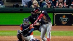 Washington Nationals' Anthony Rendon hits a home run against the Houston Astros during the seventh inning of Game 7 of the baseball World Series Wednesday, Oct. 30, 2019, in Houston. (AP Photo/Eric Gay)