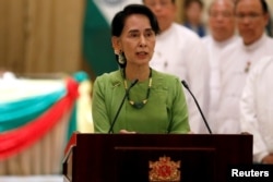 FILE - Aung San Suu Kyi talks during a news conference in Naypyitaw, Myanmar, Sept. 6, 2017.