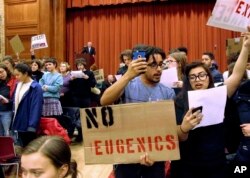Middlebury College students turn their backs to conservative author Charles Murray during his lecture in Middlebury, Vermont.
