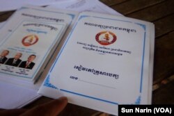 The "CPP family book," right, registers party members in a family, while the "CPP group book," left, assigns members to groups who will monitor each other's party spirit, Nov. 8, 2017.