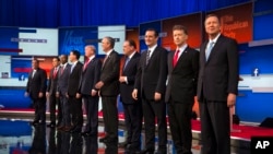 Republican presidential candidates from left, Chris Christie, Marco Rubio, Ben Carson, Scott Walker, Donald Trump, Jeb Bush, Mike Huckabee, Ted Cruz, Rand Paul, and John Kasich take the stage for the first Republican presidential debate at the Quicken Loa