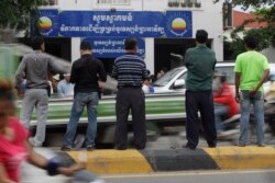 FILE PHOTO - Journalists wait in front of Cambodia National Rescue Party (CNRP) during the party's meeting, in Phnom Penh, Cambodia, Thursday, May 26, 2016. (AP Photo)