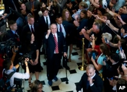 House Republican Whip Steve Scalise walks with his wife Jennifer, left, as he leaves the House chamber in the Capitol.