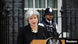 Britain's Prime Minister Theresa May speaks outside 10 Downing Street after an attack on London Bridge and Borough Market left 7 people dead and dozens injured in London, June 4, 2017.