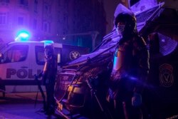 In this March 29, 2020 file photo, Egyptian security forces cordon off roads during curfew hours as prevention measures due to the coronavirus outbreak, in Cairo, Egypt. (AP Photo/Nariman El-Mofty, File)