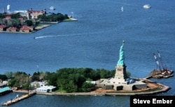 This helicopter view shows how close the Statue of Liberty is to Ellis Island. Arriving immigrants would sail past "Lady Liberty" on their way to Ellis Island. (Steve Ember)