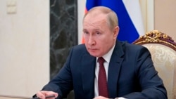 Russian President Vladimir Putin attends a Cabinet meeting via a videoconference at the Kremlin in Moscow, Russia, Jan. 12, 2022.