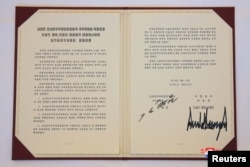 A document signed by U.S. President Donald Trump and North Korea's leader Kim Jong Un is seen in Singapore in this picture released on June 12, 2018 by North Korea's Korean Central News Agency.