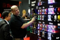 An exhibitor displays radiator fans at the Computex trade show in Taipei, Taiwan, Tuesday, June 2, 2015.