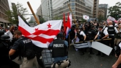 U.S. Secret Service uniformed officers clash with anarchists and antifa counter-protesters trying to block white nationalists from departing their rally across from the White House marking the one year anniversary of the 2017 Charlottesville ‘Unite the Ri