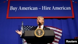 FILE - President-elect Donald Trump, pictured during his first term as president, speaks in Kenosha, Wisconsin, April 18, 2017, before signing an order directing federal agencies to recommend changes to a program that brings foreign workers to the U.S. to fill high-skilled jobs.