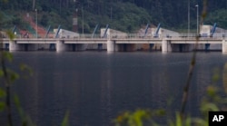 FILE - The Nam Theun 2 dam is seen on the Nam Theun river in central Laos on Oct. 24, 2010.
