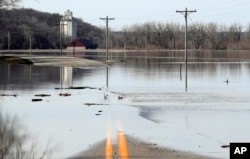 The Missouri River floods across and closes K-7 highway near White Cloud, Kansas, March 18, 2019.