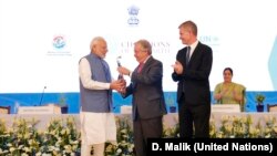Prime Minister of India Narendra Modi receives the U.N. Champions of the Earth Award from U.N. Secretary-General António Guterres along with UNEP Chief Erik Solheim, right. The award ceremony was at the Pravasi Bharatiya Kendra in New Delhi, Oct. 3, 2018.