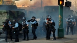Minneapolis Police Department officers monitor continued demonstrations against the death in Minneapolis police custody of African-American man George Floyd, in Minneapolis, Minnesota, U.S., May 29, 2020. Picture taken May 29, 2020. REUTERS/Lucas Jackson