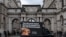 FILE - A digital advertising van, commissioned by Ukrainian campaigners, passes by the Foreign, Commonwealth & Development Office, with a message to urge Britain to stand firm against Russia's attack on Ukraine, in London, Nov. 18, 2024. 