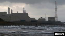 FILE - Tokyo Electric Power Co.'s (TEPCO) Kashiwazaki Kariwa nuclear power plant, which is the world's biggest, is seen from a seaside in Kashiwazaki, Nov. 12, 2012. 
