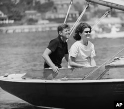 Democratic presidential nominee Sen. John F. Kennedy and wife Jacqueline in cockpit of their sailboat, Victura at Hyannis Port, Mass., Aug. 7, 1960.