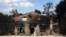 A burned house is seen in Agios Andreas, east of Athens, Tuesday, July 24, 2018. 