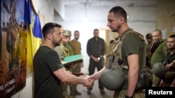 Ukraine's President Volodymyr Zelenskiy awards Ukrainian service members during his visit to a frontline, amid Russia's attack on Ukraine, near the city of Pokrovsk, Donetsk region, Ukraine, June 26, 2024.