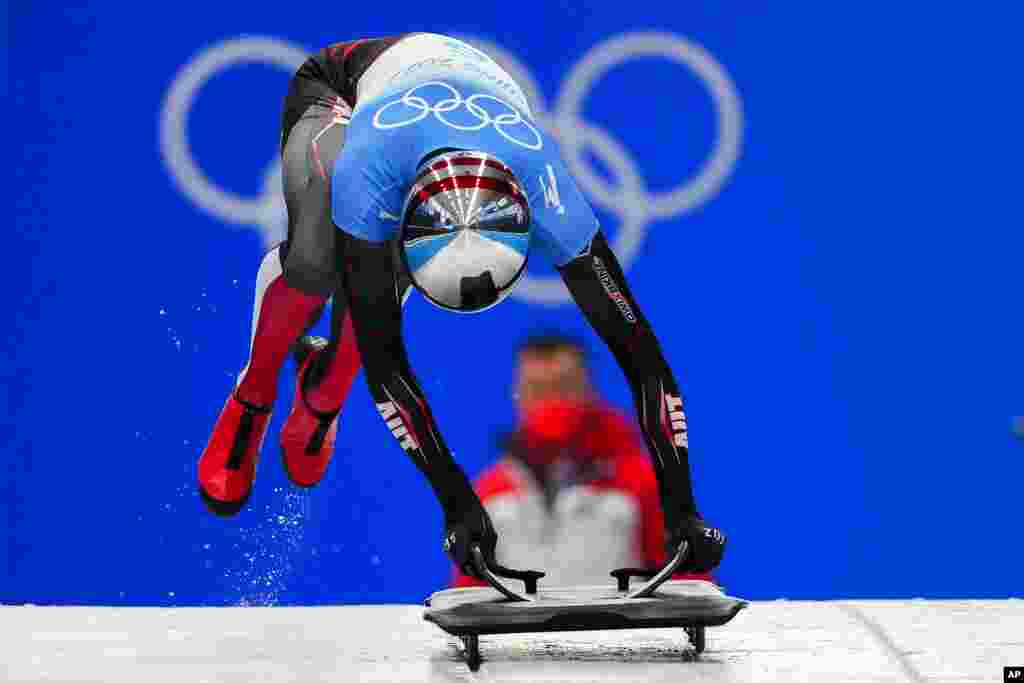 Janine Flock of Austria slides during the women's skeleton run 2 at the 2022 Winter Olympics, in the Yanqing district of Beijing.