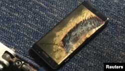 FILE - The burned Samsung Note 7 smartphone belonging to Brian Green is pictured in this undated handout photo obtained by Reuters, Oct. 6, 2016. 