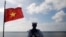 FILE - A Vietnamese naval soldier stands quard at Thuyen Chai island in the Spratly archipelago January 17, 2013. (Reuters)