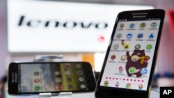 FILE - New Lenovo Vibe X smartphones displayed at IFA, one of the world's largest trade fairs for electronics and electrical appliances, Berlin, Sept. 5, 2013.