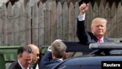 Republican U.S. presidential candidate Donald Trump waves after meeting with House Republican members in Washington, July 7, 2016.