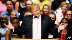 Republican presidential candidate Donald Trump speaks at a rally and picnic in Oskaloosa, Iowa, July 25, 2015.