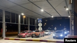 FILE PHOTO: Cars are waiting at the Nuijamaa border checkpoint between Russia and Finland