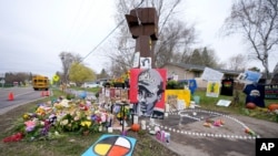 A makeshift memorial is seen at the site where Daunte Wright was killed a day after he was laid to rest, April 23, 2021, in Brooklyn Center, Minn. The 20-year-old Wright was killed by then-Brooklyn Center police officer Kim Potter during a traffic stop.