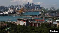 A view of Sentosa island and the skyline of the central business district in Singapore, June 4, 2018.