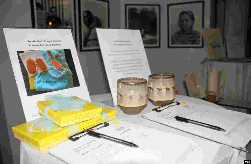 Auction items at a Washington, DC fundraiser and silent auction organized by Caring for Cambodia, a non-profit to help support 21 impoverished schools in Cambodia's Siem Reap province, May 4, 2017. (VOA Khmer)