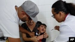 A boy cries as he receives a vaccine against yellow fever at a public health center in Sao Paulo, Brazil, Jan. 16, 2018.