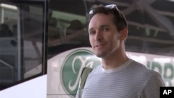 In this image made from a video, Australian Broadcasting Corp. journalist Bill Birtles speaks to the media on his arrival at Sydney airport, Australia Tuesday, Sept. 8, 2020. Birtles and The Australian Financial Review journalist Michael Smith, the…