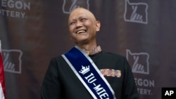 Cheng "Charlie" Saephan laughs while speaking during a press conference after it was revealed that he was one of the winners of the $1.3 billion Powerball jackpot at the Oregon Lottery headquarters on April 29, 2024, in Salem, Ore. 