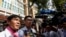 FILE - Uon Chhin and Yeang Sothearin, former journalists for U.S.-funded Radio Free Asia (RFA), speak to the media in front of the Municipal Court of Phnom Penh, in Phnom Penh, Cambodia, Oct. 3, 2019.