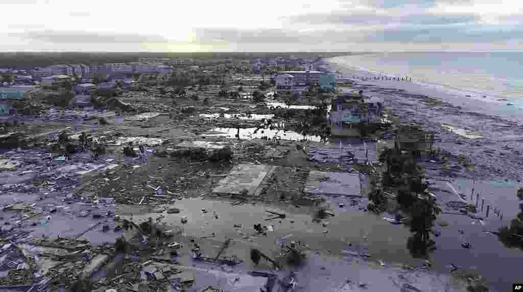  In this image made from video and provided by SevereStudios.com, damage from Hurricane Michael is seen in Mexico Beach, Fla. on Thursday, Oct. 11, 2018. Search-and-rescue teams fanned out across the Florida Panhandle to reach trapped people in Michael's wake Thursday as daylight yielded scenes of rows upon rows of houses smashed to pieces by the third-most powerful hurricane on record to hit the continental U.S. (SevereStudios.com via AP) 