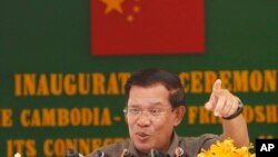 Cambodia's Prime Minister Hun Sen gestures as he delivers a speech during his presiding over an inauguration ceremony for the official use of a friendship bridge between Cambodia and China at Takhmau, Kandal provincial town south of Phnom Penh, Cambodia, file photo. 