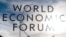 The sign of the World Economic Forum, WEF, is displayed at an entrance door at the congress center at the eve of the meeting in Davos, Sunday, Jan. 20, 2019. (AP Photo/Markus Schreiber)